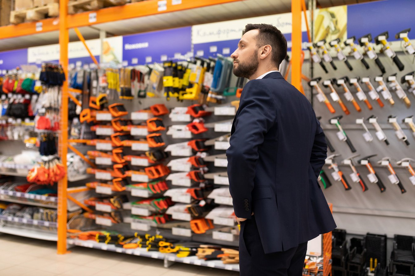 Manager in a Hardware Store Inspects Retail Space